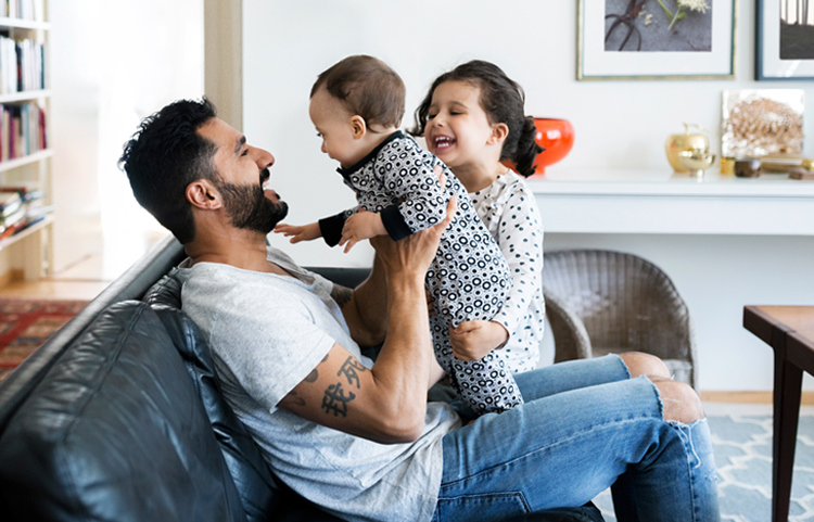 Father playing with his children