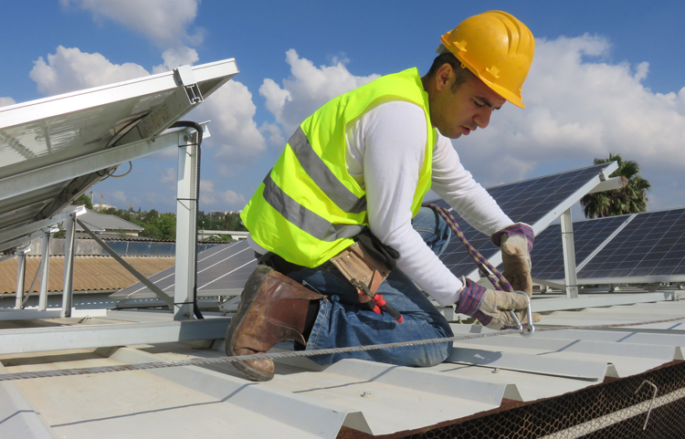 Man installing solar power panels